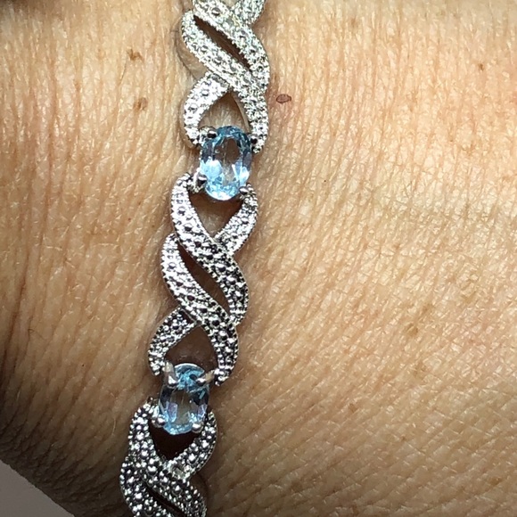 Rhodium Plated Blue Topaz Infinity Bracelet - Picture 9 of 11